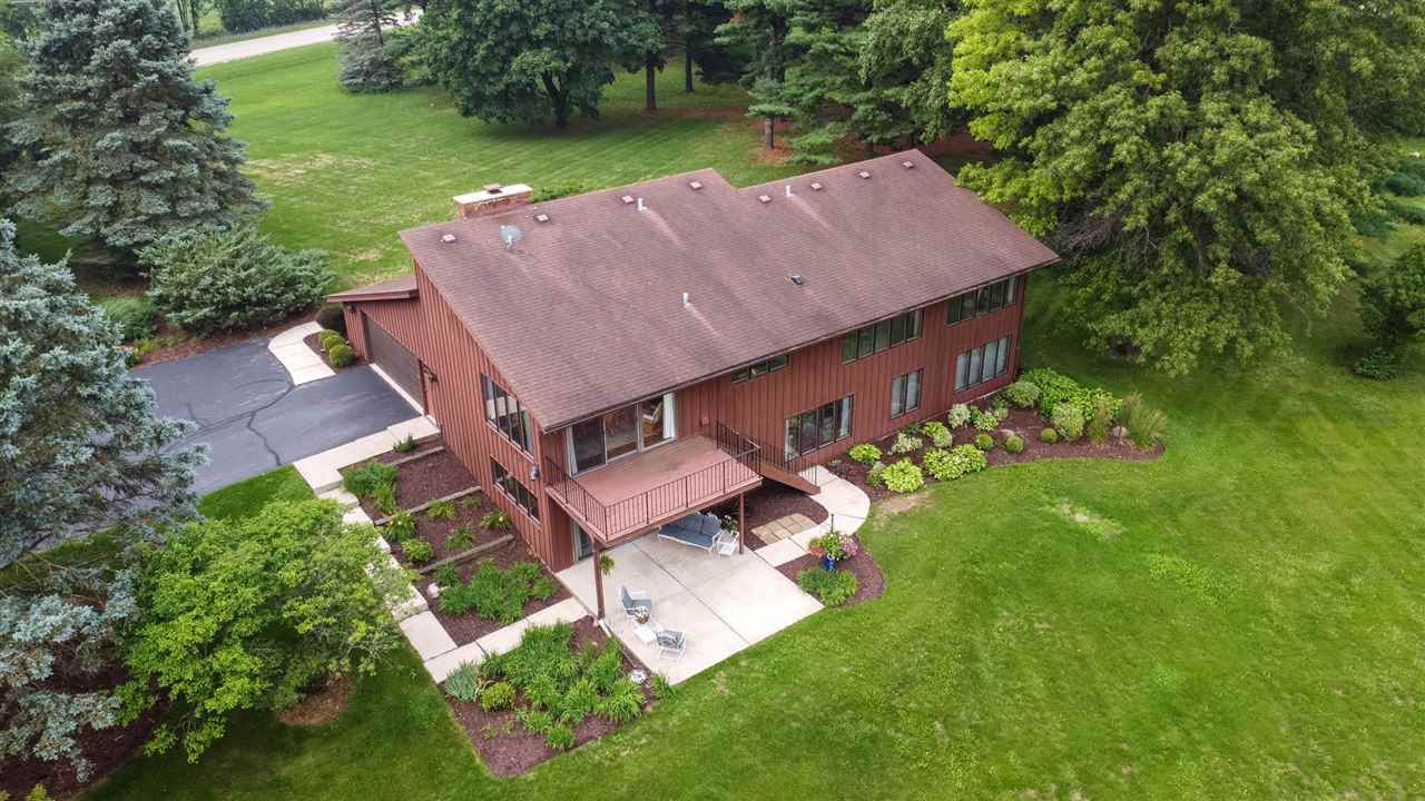 7676 Swanson Road Roscoe, IL 61073 - Photo 38 of 39 an aerial view of a house with garden space and street view
