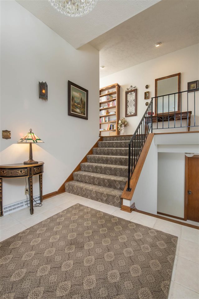 7676 Swanson Road Roscoe, IL 61073 - Photo 8 of 39 a view of a livingroom with furniture and staircase