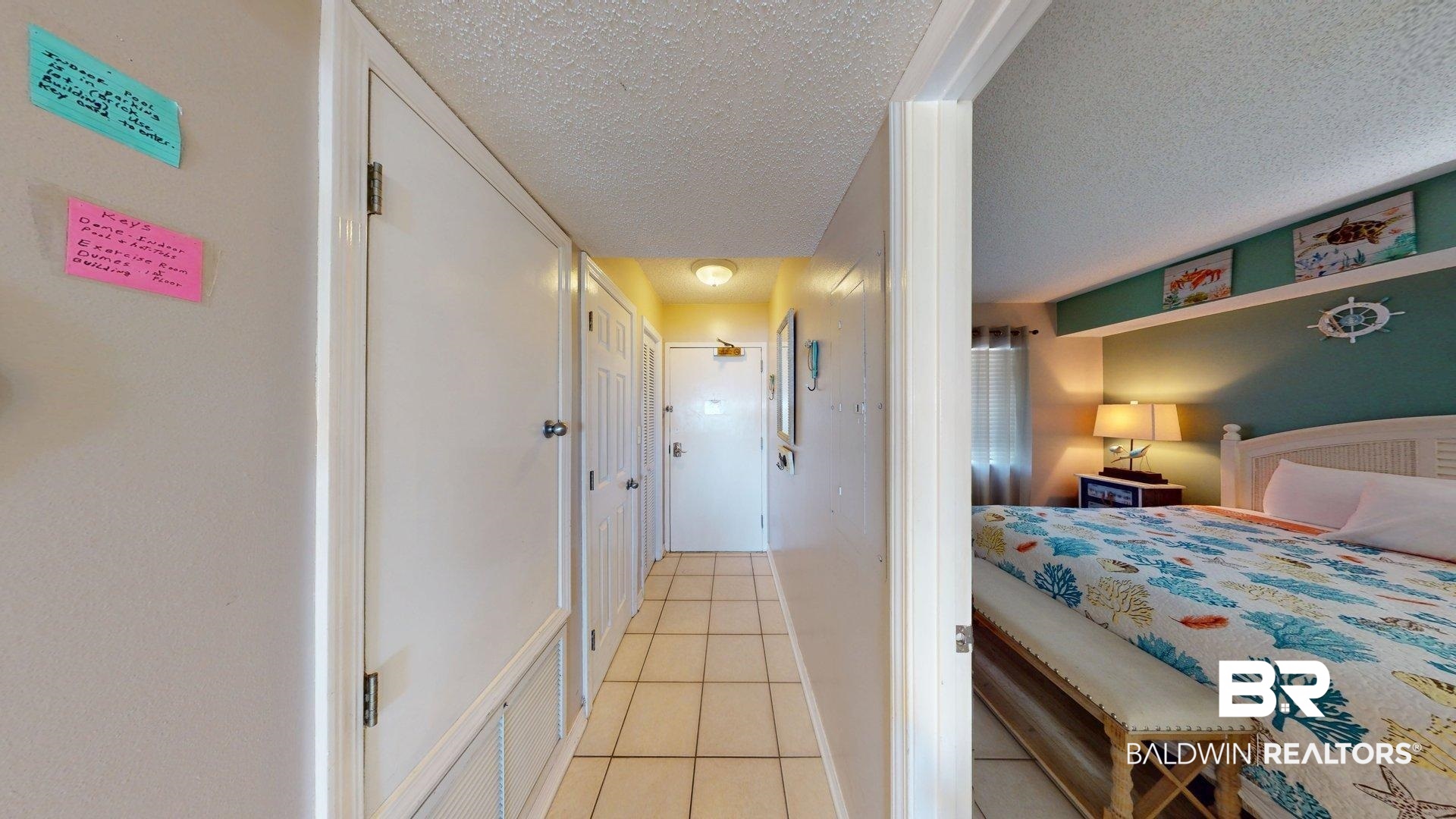 645 Plantation Road, Unit 6503 Gulf Shores, AL 36542 - Photo 51 of 53 Bedroom with a textured ceiling and light tile patterned flooring