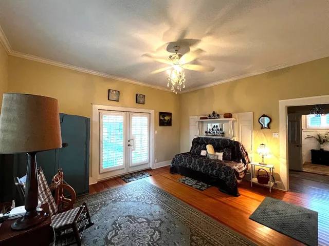 a bedroom with furniture and a window