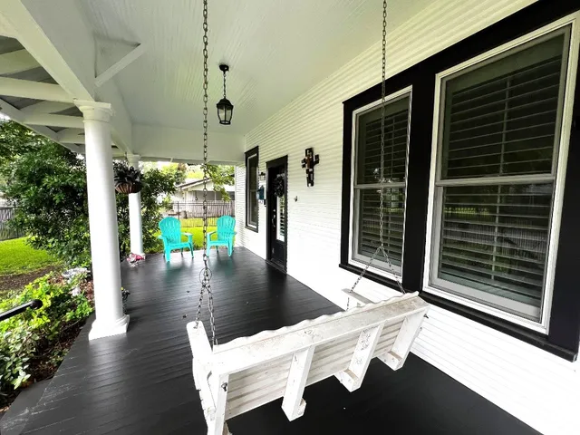 a view of a porch with furniture