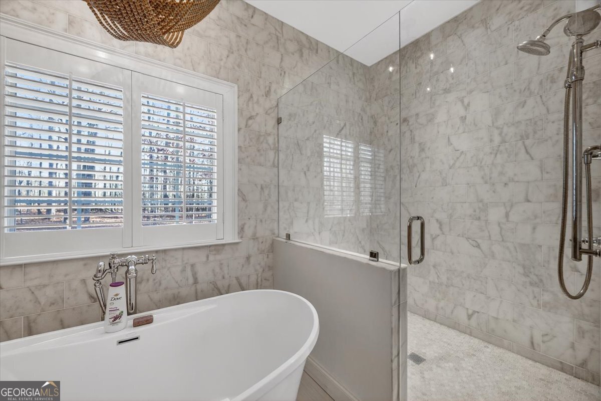 242 Pebblebrook Lane Macon, GA 31220 - Photo 12 of 45 a bathroom with a tub a sink and a window
