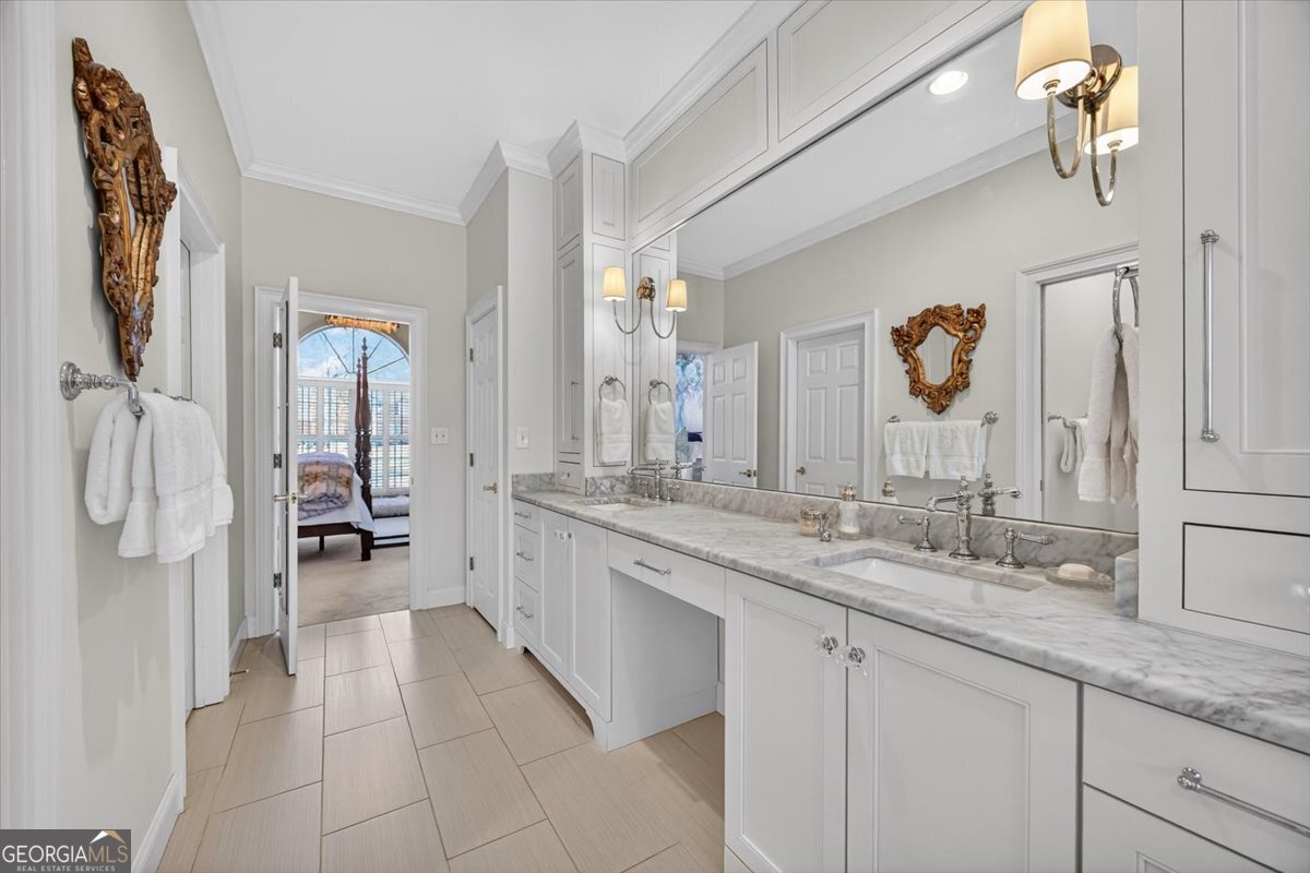 242 Pebblebrook Lane Macon, GA 31220 - Photo 13 of 45 a bathroom with a granite countertop sink two mirror and shower