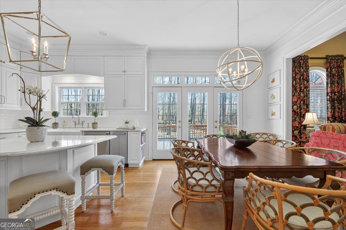 242 Pebblebrook Lane Macon, GA 31220 - Photo 17 of 45 a view of a dining room with furniture wooden floor and chandelier