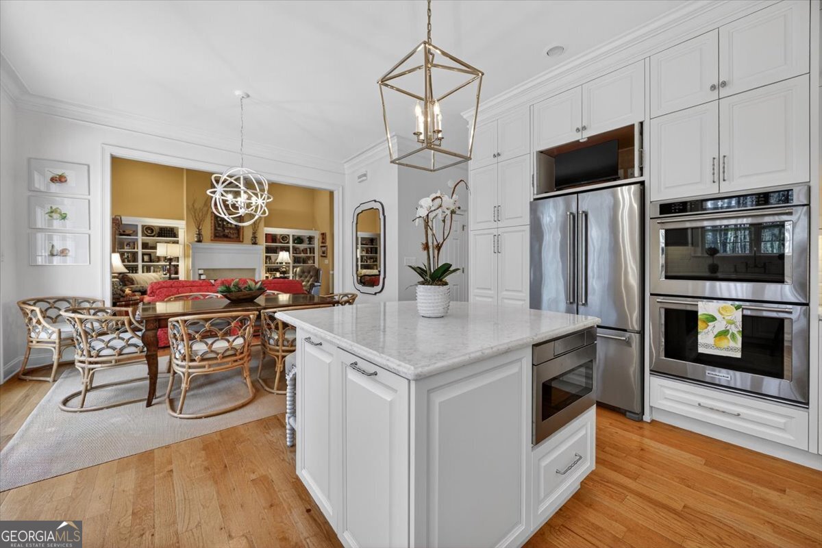 242 Pebblebrook Lane Macon, GA 31220 - Photo 20 of 45 a kitchen with stainless steel appliances granite countertop a stove and a refrigerator