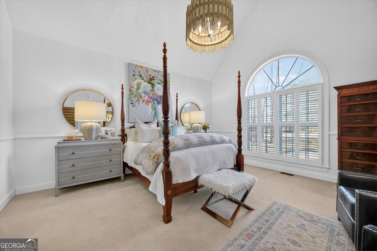 242 Pebblebrook Lane Macon, GA 31220 - Photo 22 of 45 a bedroom with a bed and a mirror on dresser