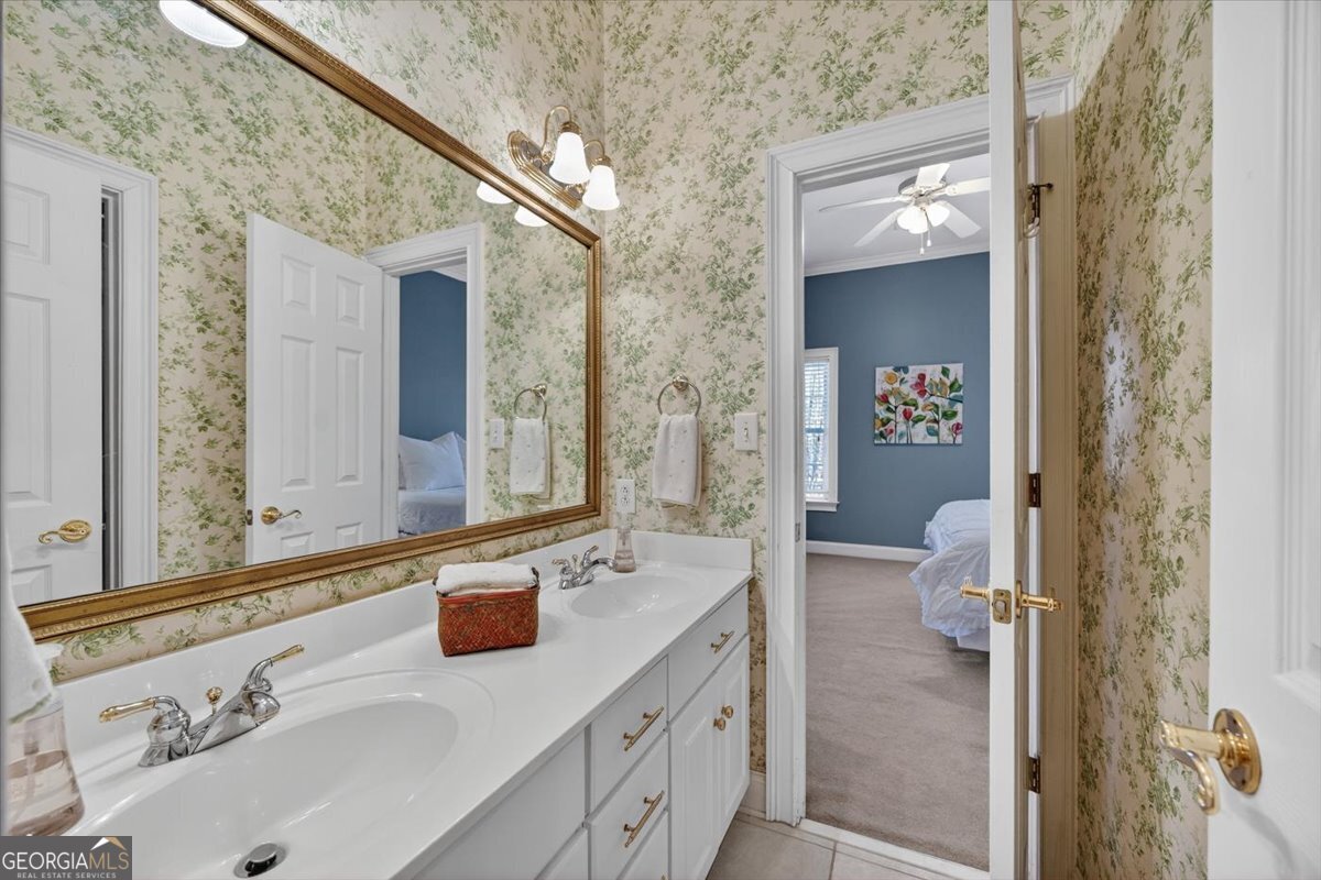242 Pebblebrook Lane Macon, GA 31220 - Photo 24 of 45 a bathroom with a sink and mirror with toilet
