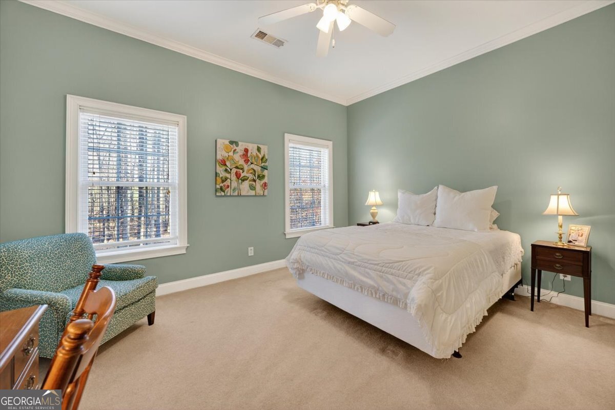 242 Pebblebrook Lane Macon, GA 31220 - Photo 33 of 45 a bedroom with a bed and a chandelier