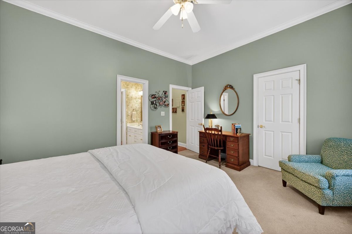 242 Pebblebrook Lane Macon, GA 31220 - Photo 34 of 45 a bed room with furniture and a chandelier