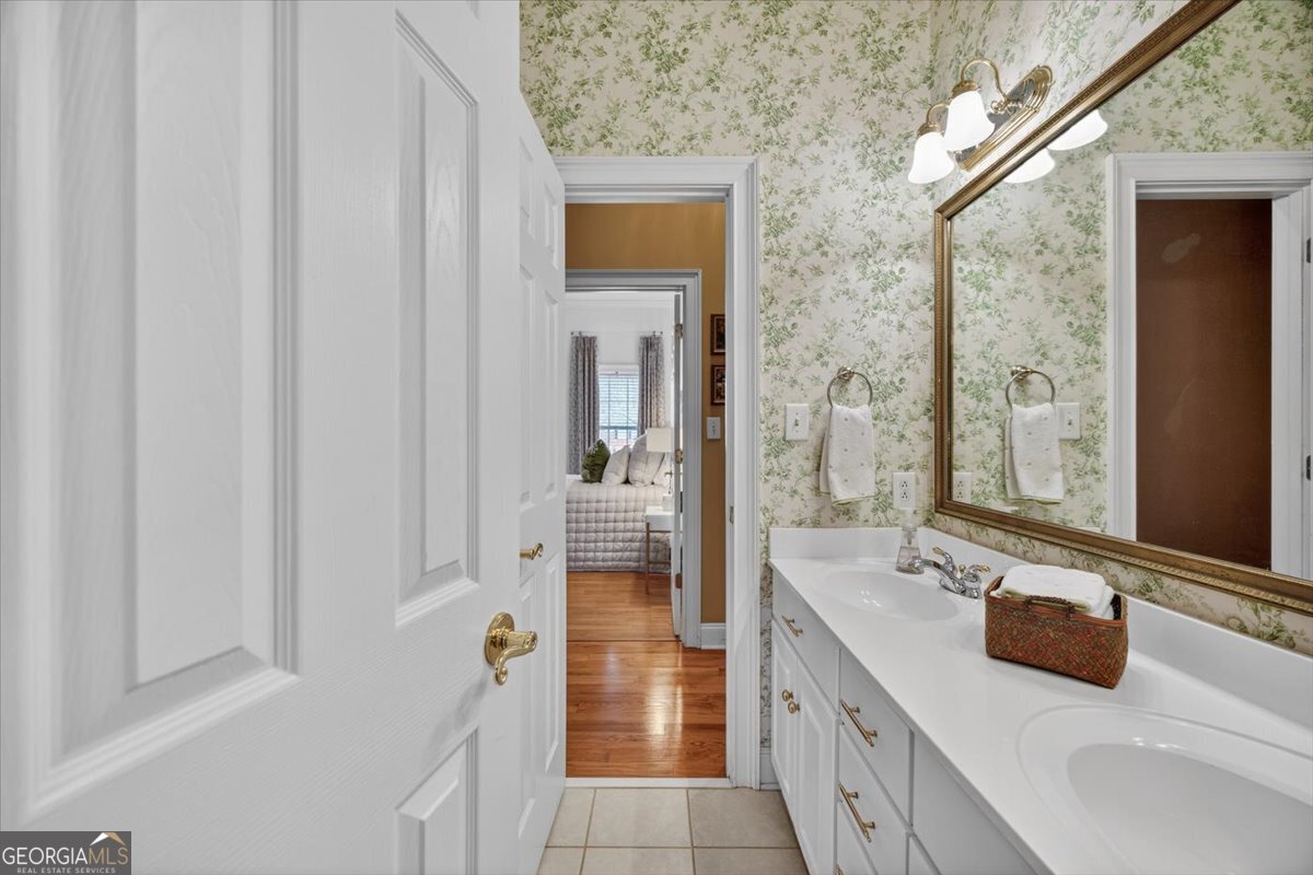 242 Pebblebrook Lane Macon, GA 31220 - Photo 35 of 45 a spacious bathroom with a double vanity sink and a mirror