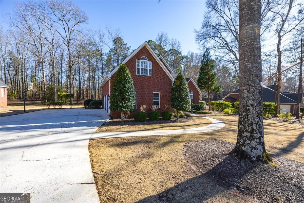 242 Pebblebrook Lane Macon, GA 31220 - Photo 44 of 45 a view of a house with a yard and large tree