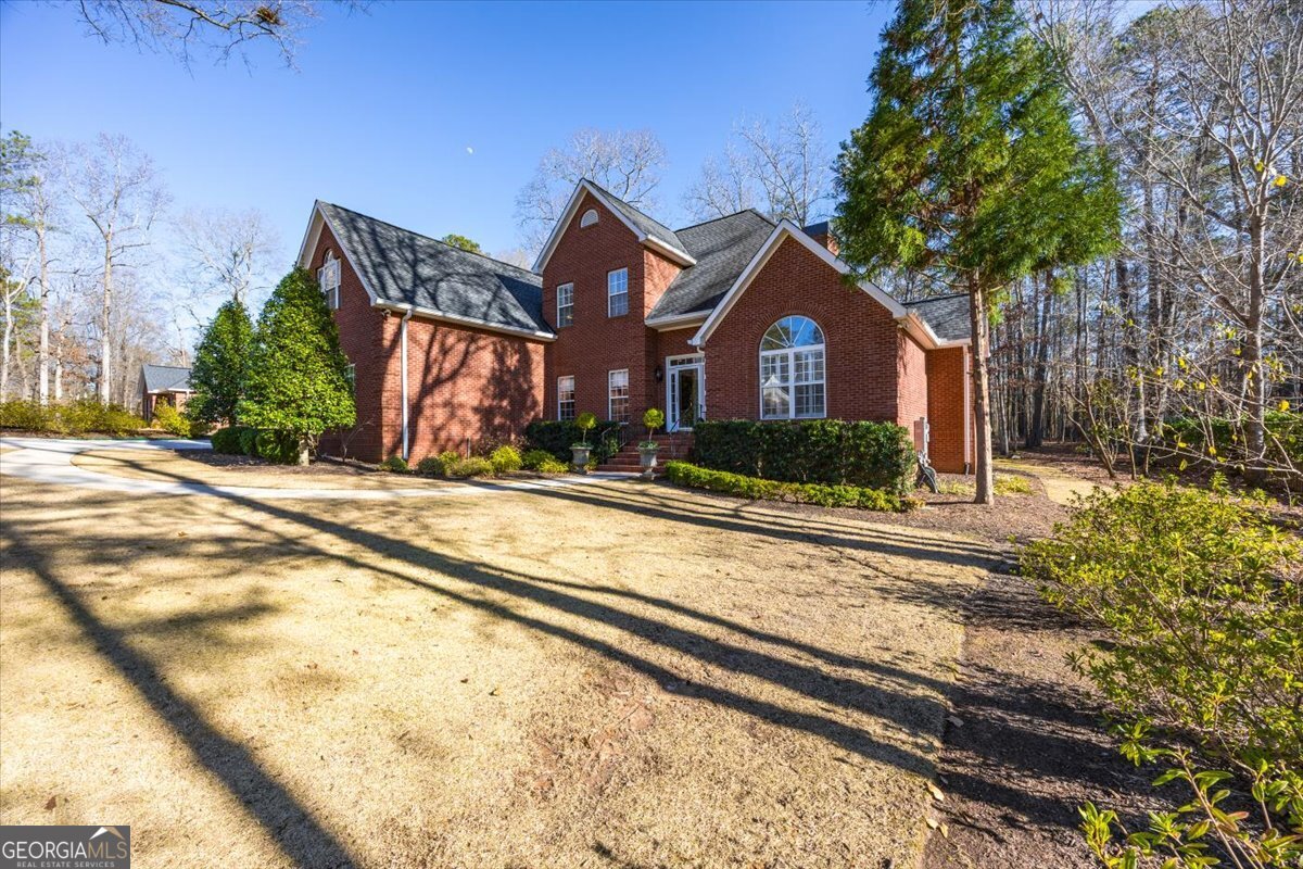 242 Pebblebrook Lane Macon, GA 31220 - Photo 45 of 45 a front view of a house with a yard
