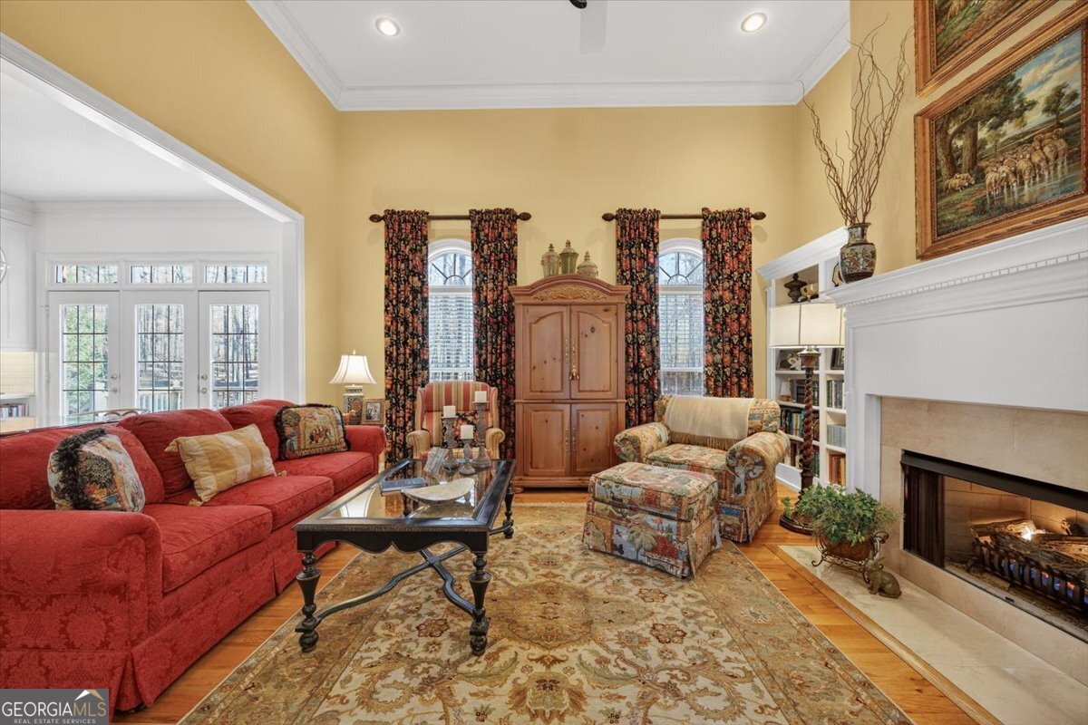 242 Pebblebrook Lane Macon, GA 31220 - Photo 6 of 45 a living room with furniture fireplace and a large window