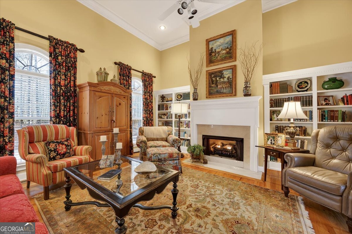 242 Pebblebrook Lane Macon, GA 31220 - Photo 7 of 45 a living room with furniture a fireplace and a flat screen tv