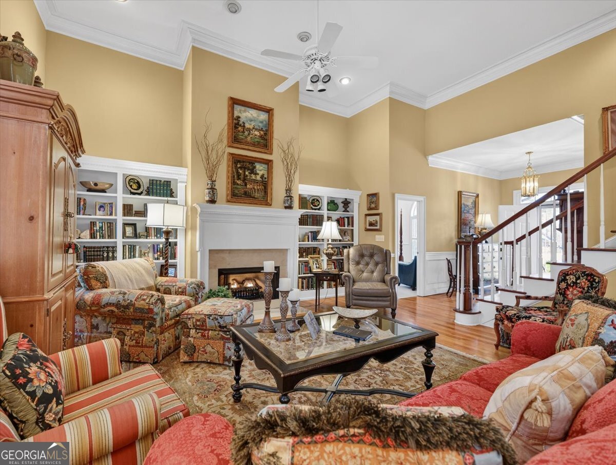 242 Pebblebrook Lane Macon, GA 31220 - Photo 8 of 45 a living room with furniture a fireplace and a large window