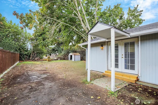 a house with trees in the background
