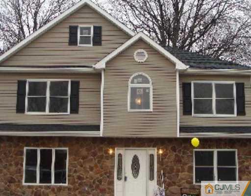32 Parkerson Road Edison, NJ 08817 - Photo 1 of 4 a front view of a house with windows
