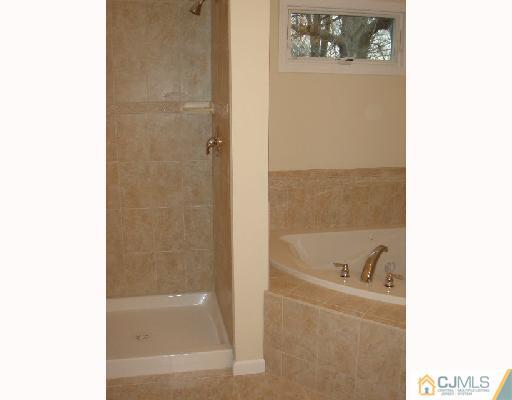 32 Parkerson Road Edison, NJ 08817 - Photo 4 of 4 a bathroom with a bathtub