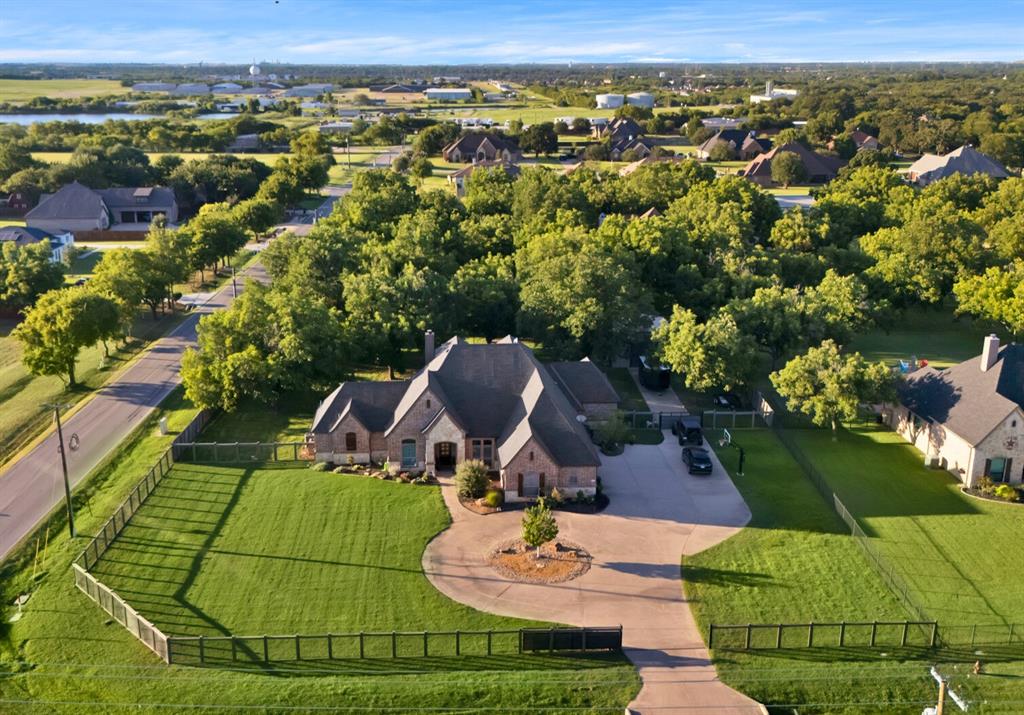 an aerial view of a residential houses with outdoor space