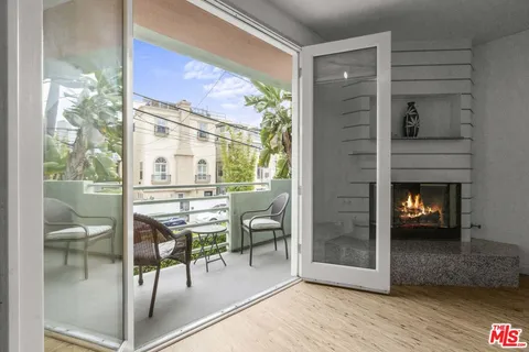 a dining room with furniture and a fireplace