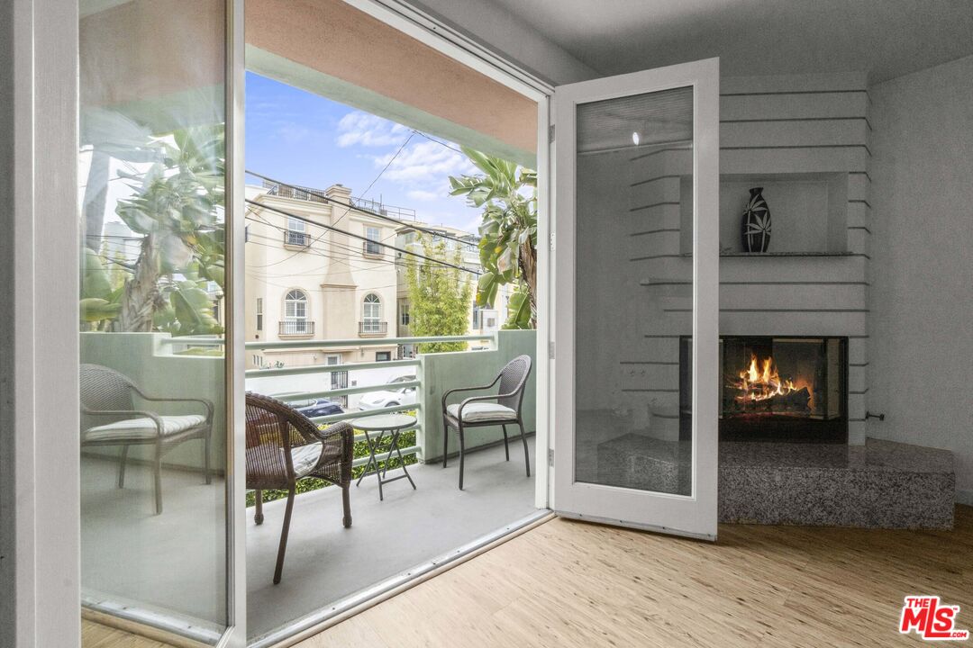 a dining room with furniture and a fireplace