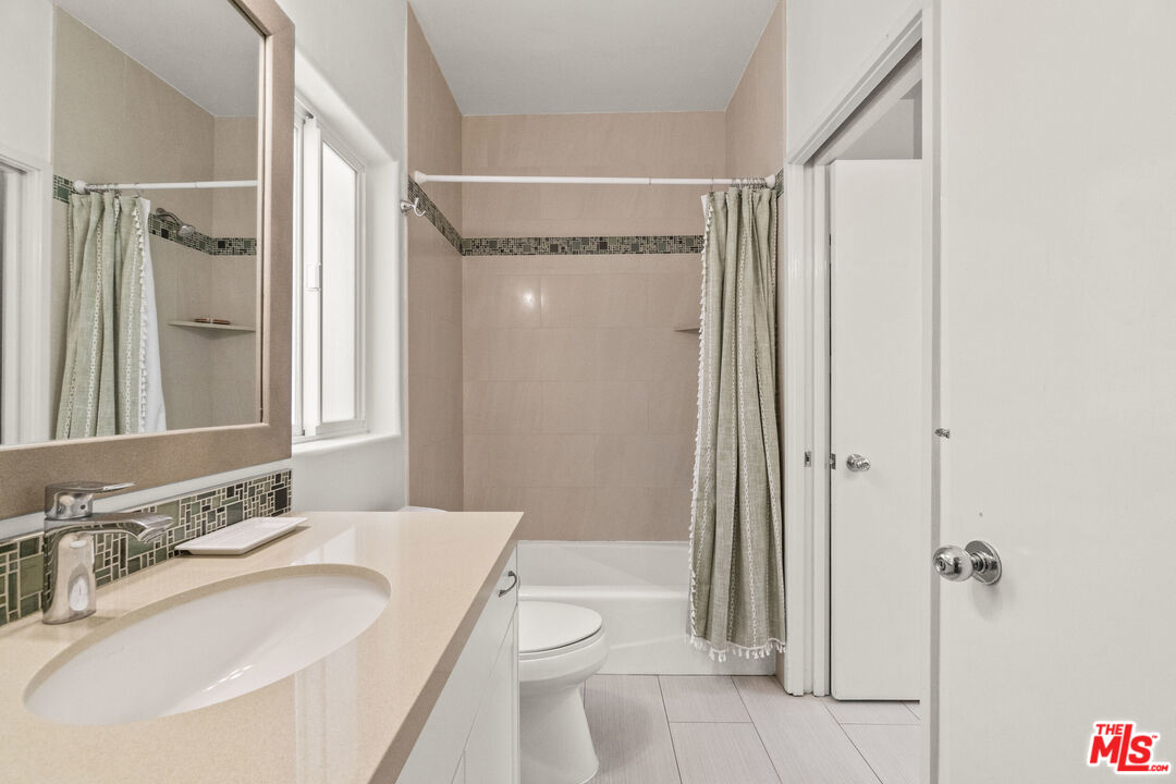 123 Galleon Street, Unit B Marina del Rey, CA 90292 - Photo 19 of 43 a bathroom with a sink a toilet and shower