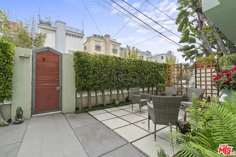 a view of a chairs and tables in the patio