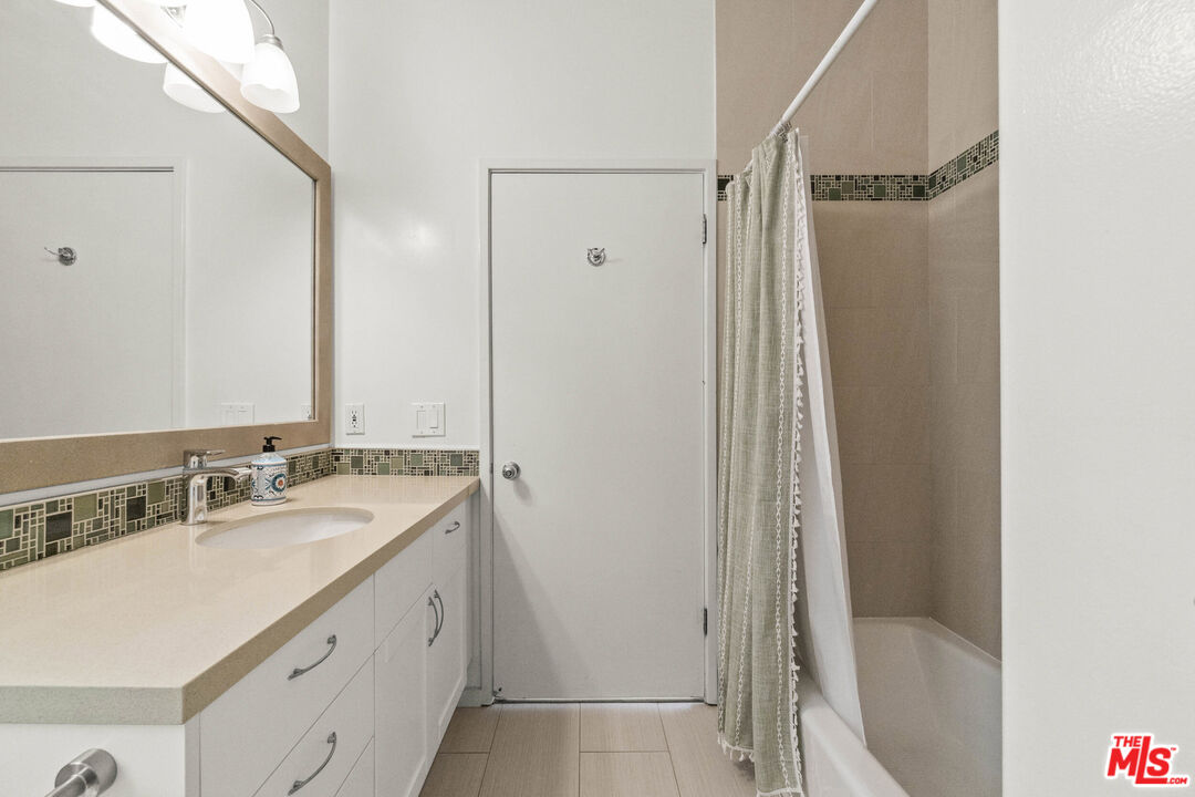 123 Galleon Street, Unit B Marina del Rey, CA 90292 - Photo 28 of 43 a bathroom with a granite countertop sink toilet and shower