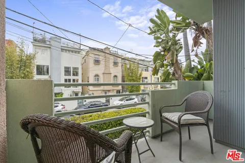 a view of balcony with furniture