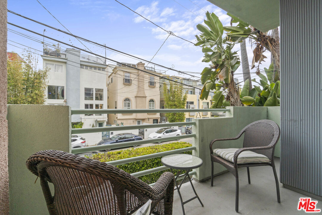 123 Galleon Street, Unit B Marina del Rey, CA 90292 - Photo 29 of 43 a dining room with furniture and a floor to ceiling window