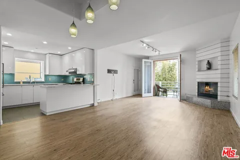 a view of a kitchen with a sink and a stove top oven