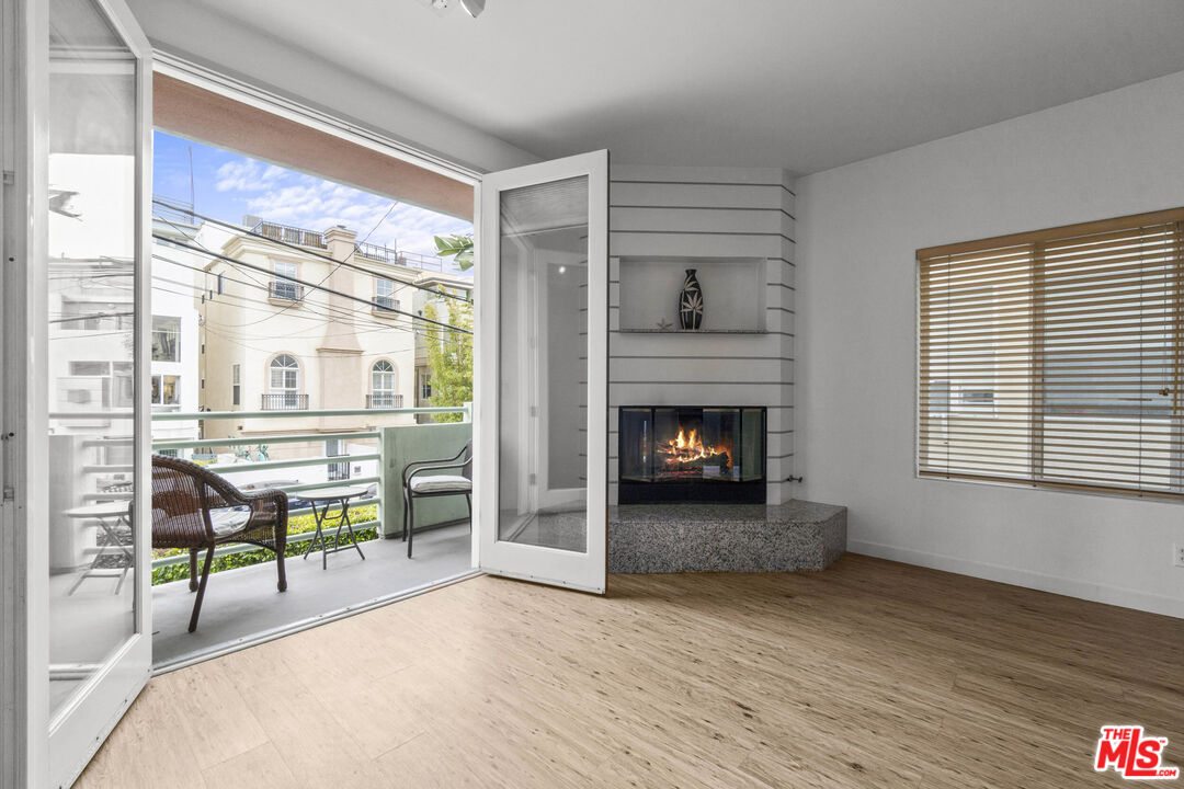 123 Galleon Street, Unit B Marina del Rey, CA 90292 - Photo 6 of 43 a living room with furniture and a fireplace