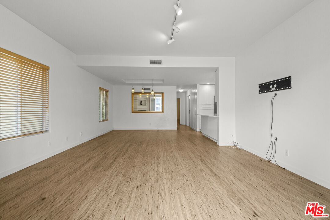 123 Galleon Street, Unit B Marina del Rey, CA 90292 - Photo 9 of 43 a view of empty room with wooden floor and fan