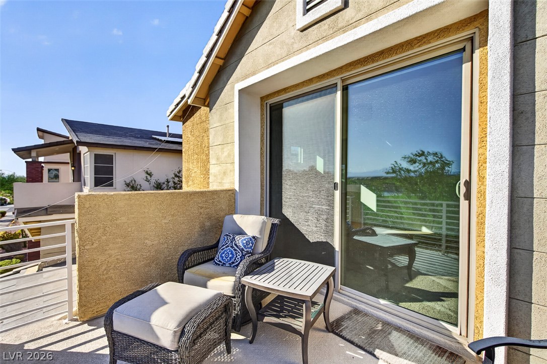 1100 East Sunset Road Henderson, NV 89011 - Photo 43 of 58 An inviting balcony offers serene outdoor living and distant scenic views.