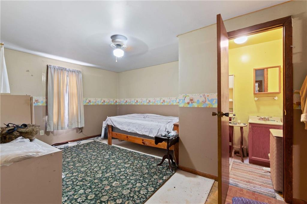 703 Indiana Avenue Monaca, PA 15061 - Photo 12 of 22 a bedroom with a bed and a window