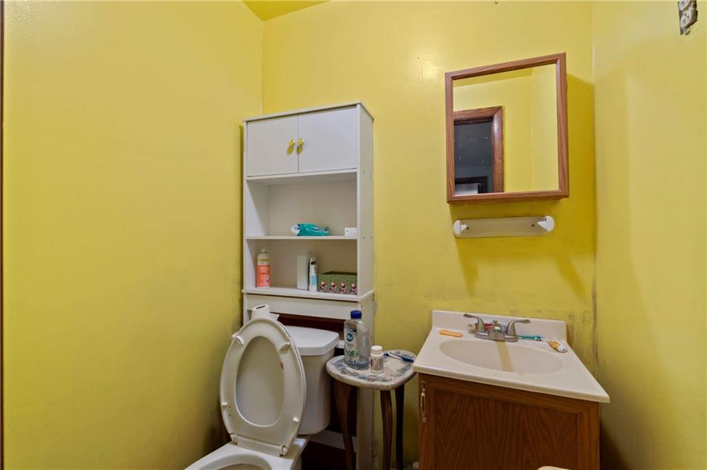 703 Indiana Avenue Monaca, PA 15061 - Photo 13 of 22 a bathroom with a sink and a mirror