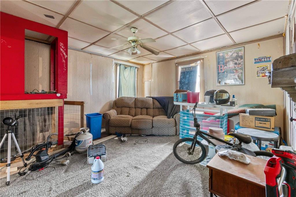 703 Indiana Avenue Monaca, PA 15061 - Photo 14 of 22 a living room with furniture a window and a fireplace