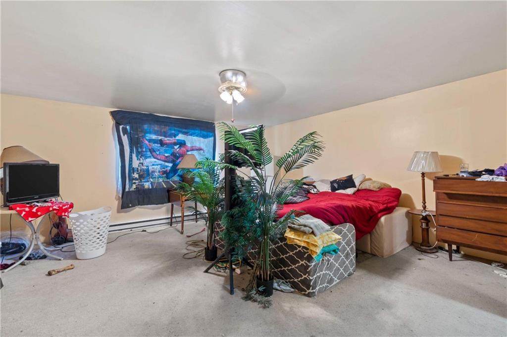 703 Indiana Avenue Monaca, PA 15061 - Photo 18 of 22 a bedroom with furniture and a flat screen tv