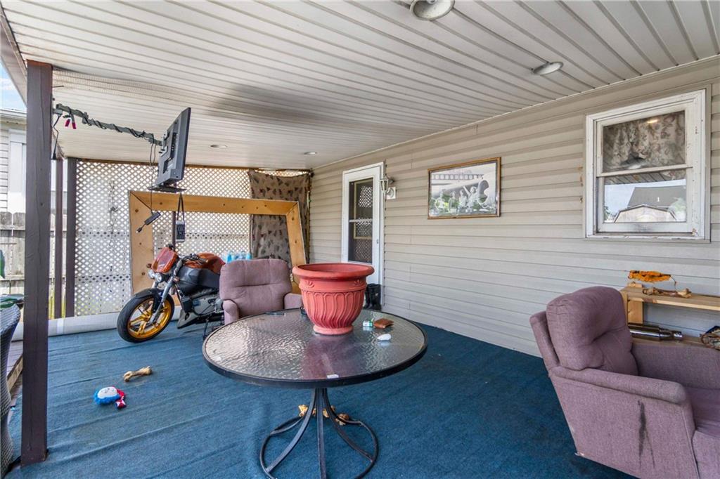 703 Indiana Avenue Monaca, PA 15061 - Photo 20 of 22 a living room with furniture and a wooden floor