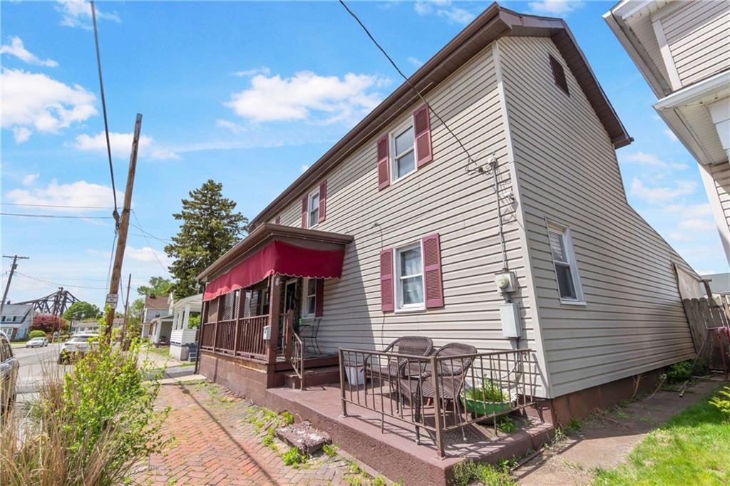 703 Indiana Avenue Monaca, PA 15061 - Photo 2 of 22 a front view of a house with garden