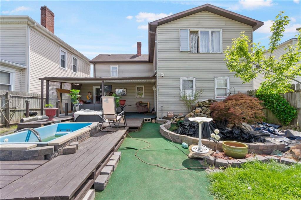 703 Indiana Avenue Monaca, PA 15061 - Photo 21 of 22 a view of a house with backyard and sitting area
