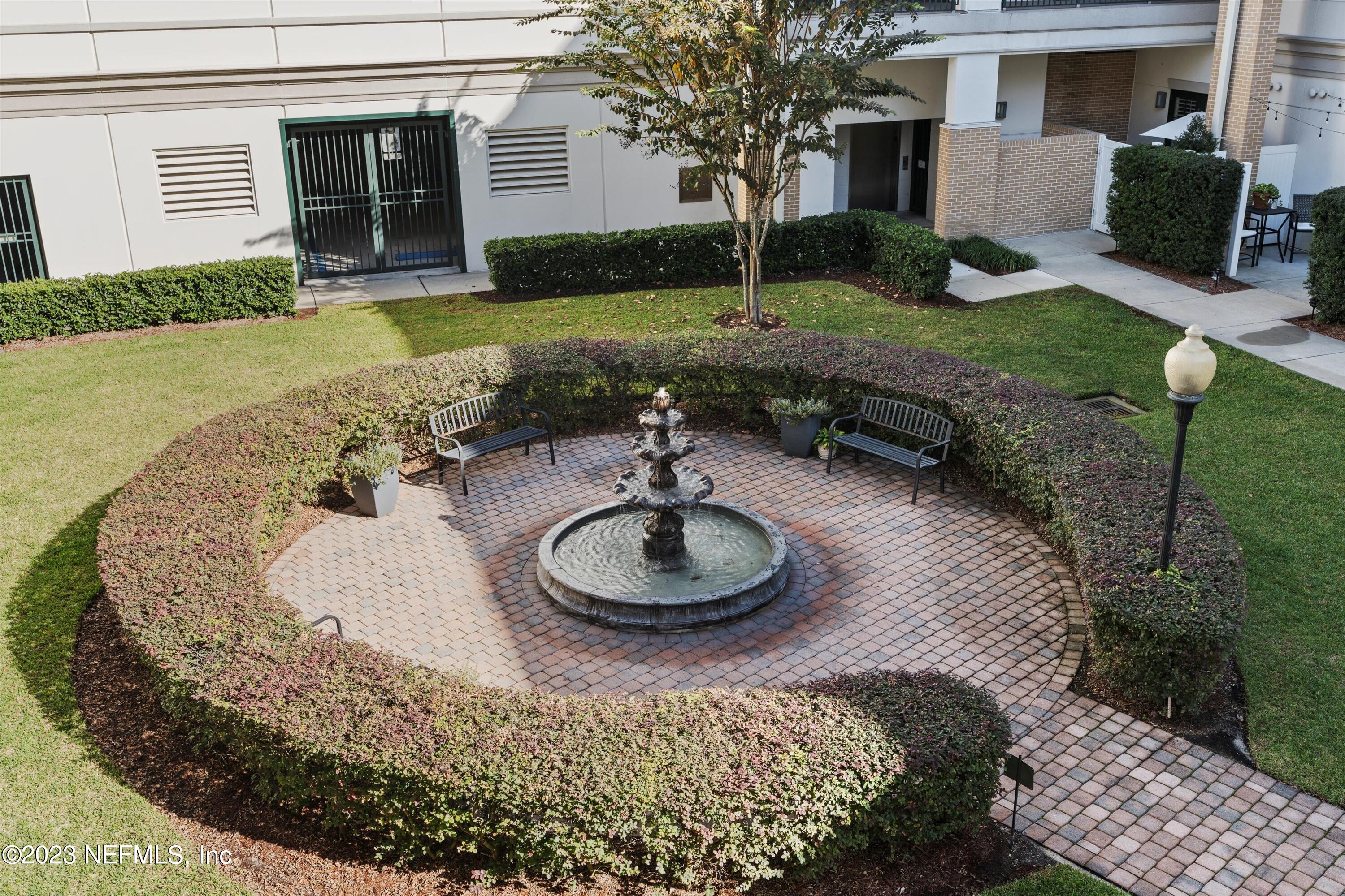 1661 Riverside Avenue, Unit 211 Jacksonville, FL 32204 - Photo 19 of 32 a front view of a house with garden