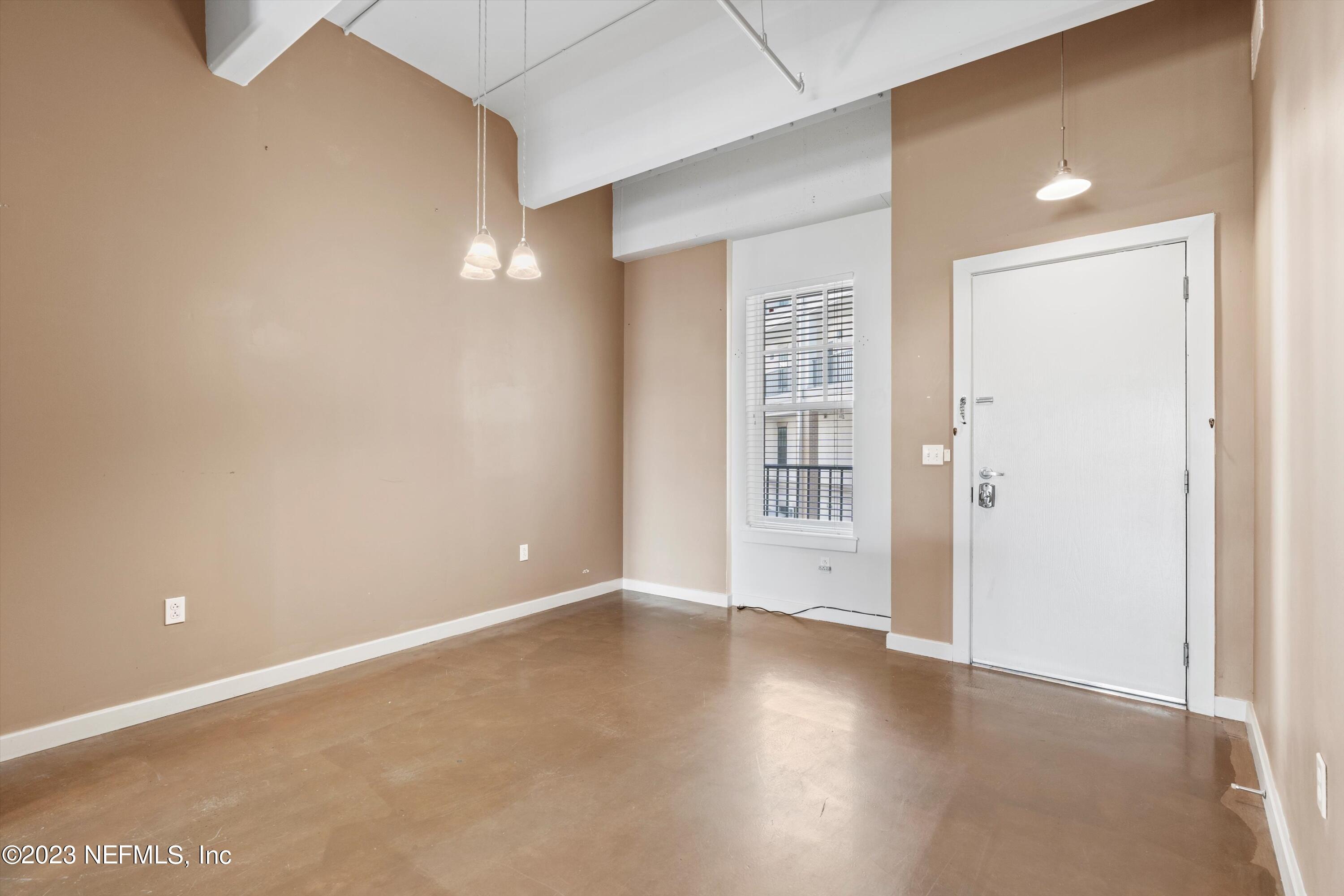 1661 Riverside Avenue, Unit 211 Jacksonville, FL 32204 - Photo 2 of 32 an empty room with windows and closet