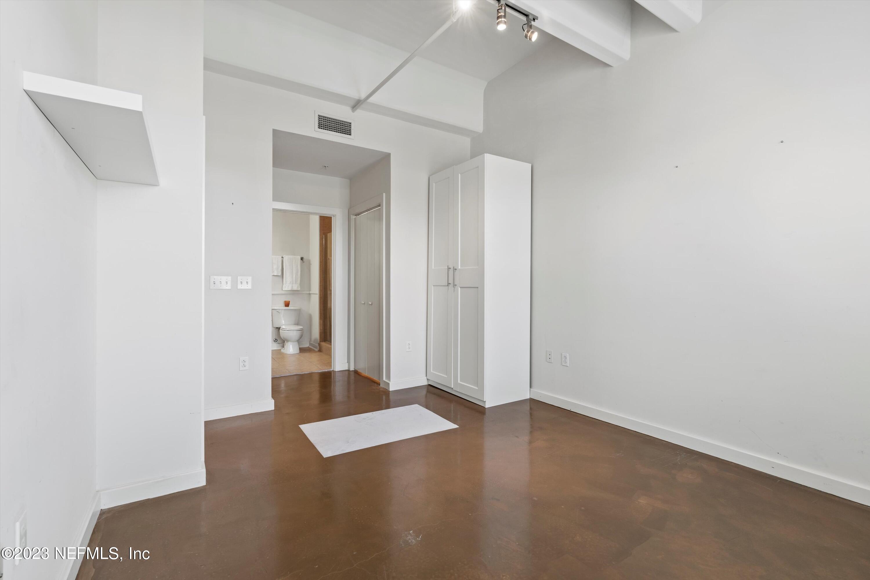 1661 Riverside Avenue, Unit 211 Jacksonville, FL 32204 - Photo 25 of 32 an empty room with closet and a hallway