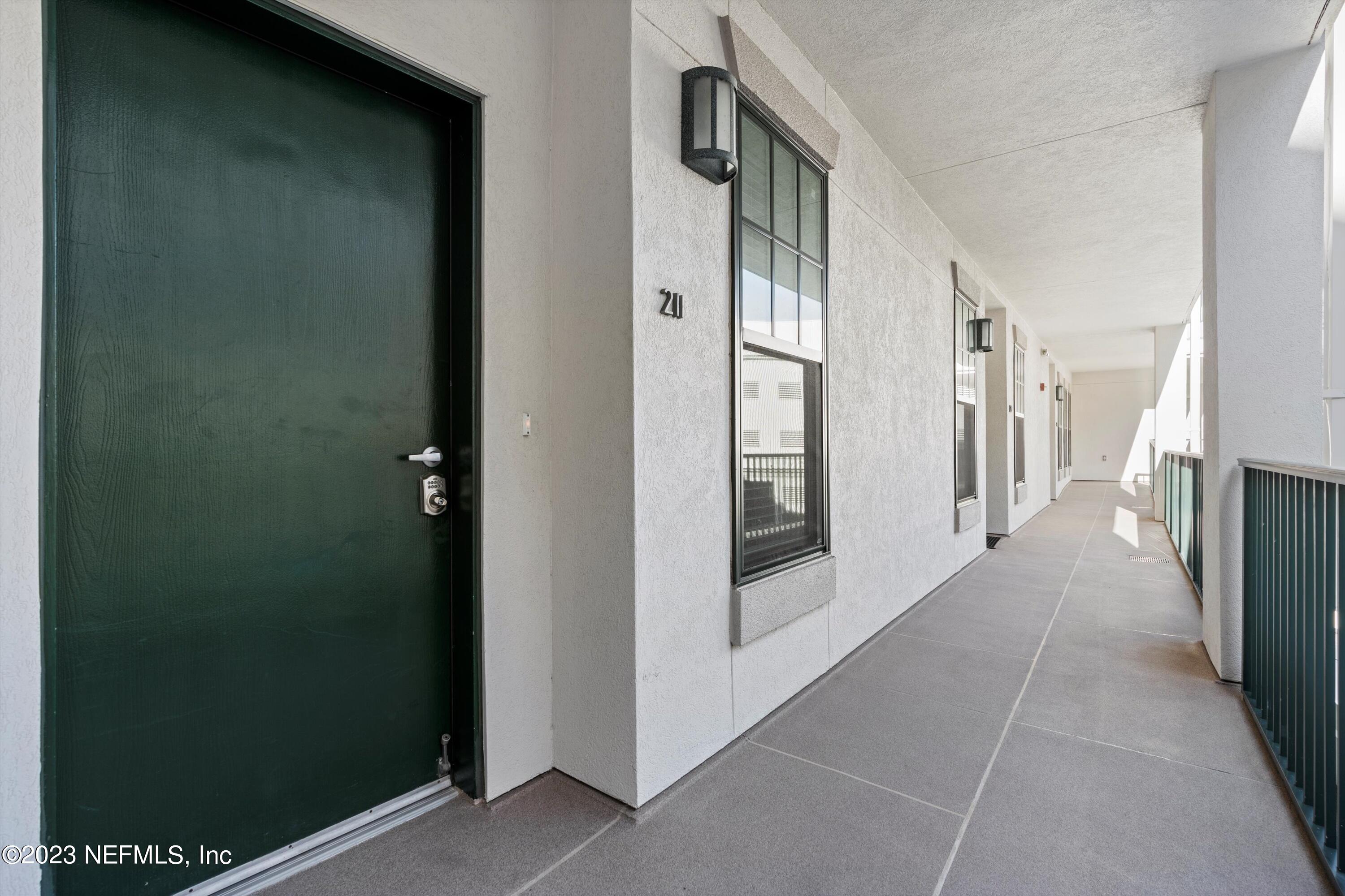 1661 Riverside Avenue, Unit 211 Jacksonville, FL 32204 - Photo 31 of 32 a view of a hallway with a hallway