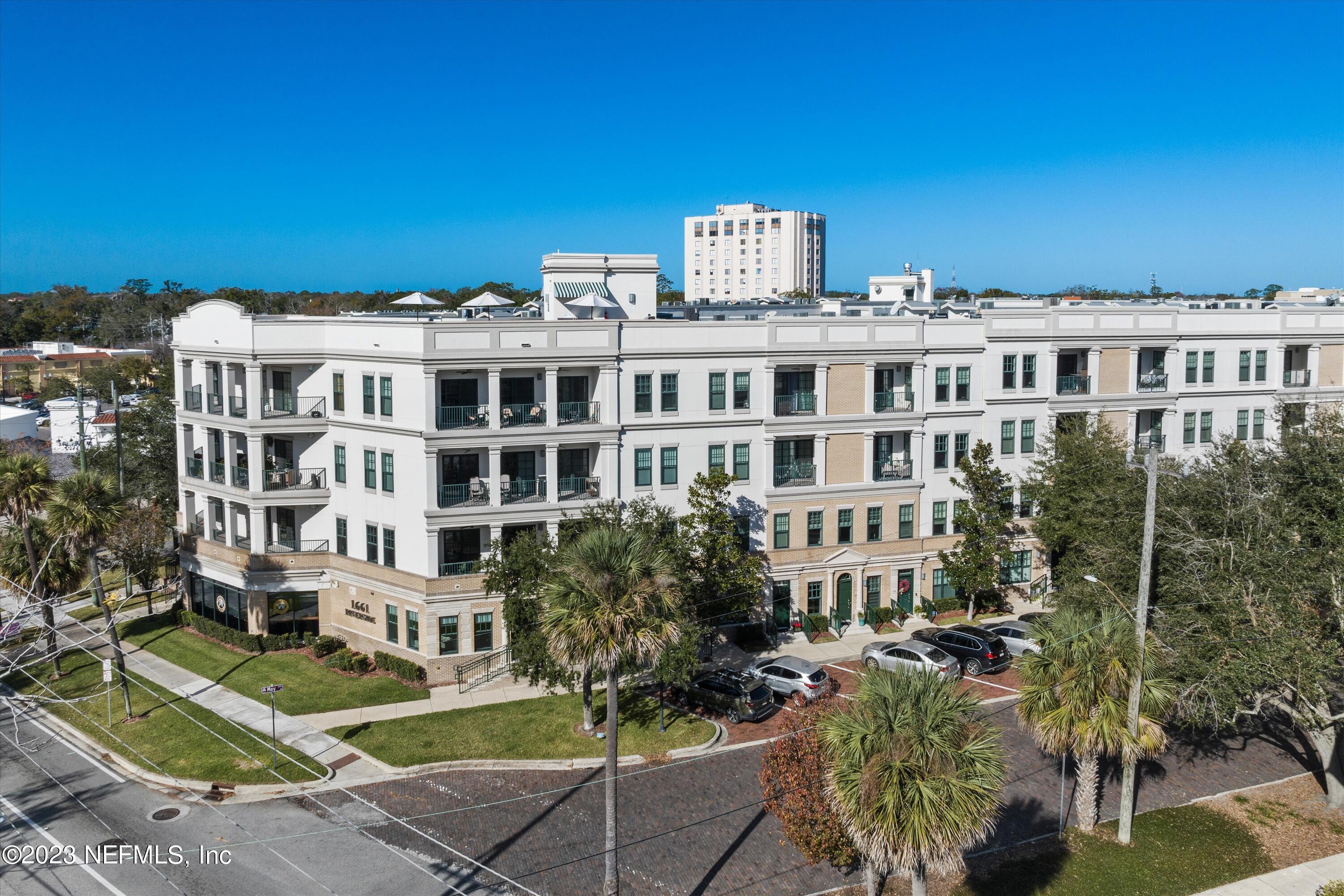 1661 Riverside Avenue, Unit 211 Jacksonville, FL 32204 - Photo 32 of 32 a front view of a building with garden