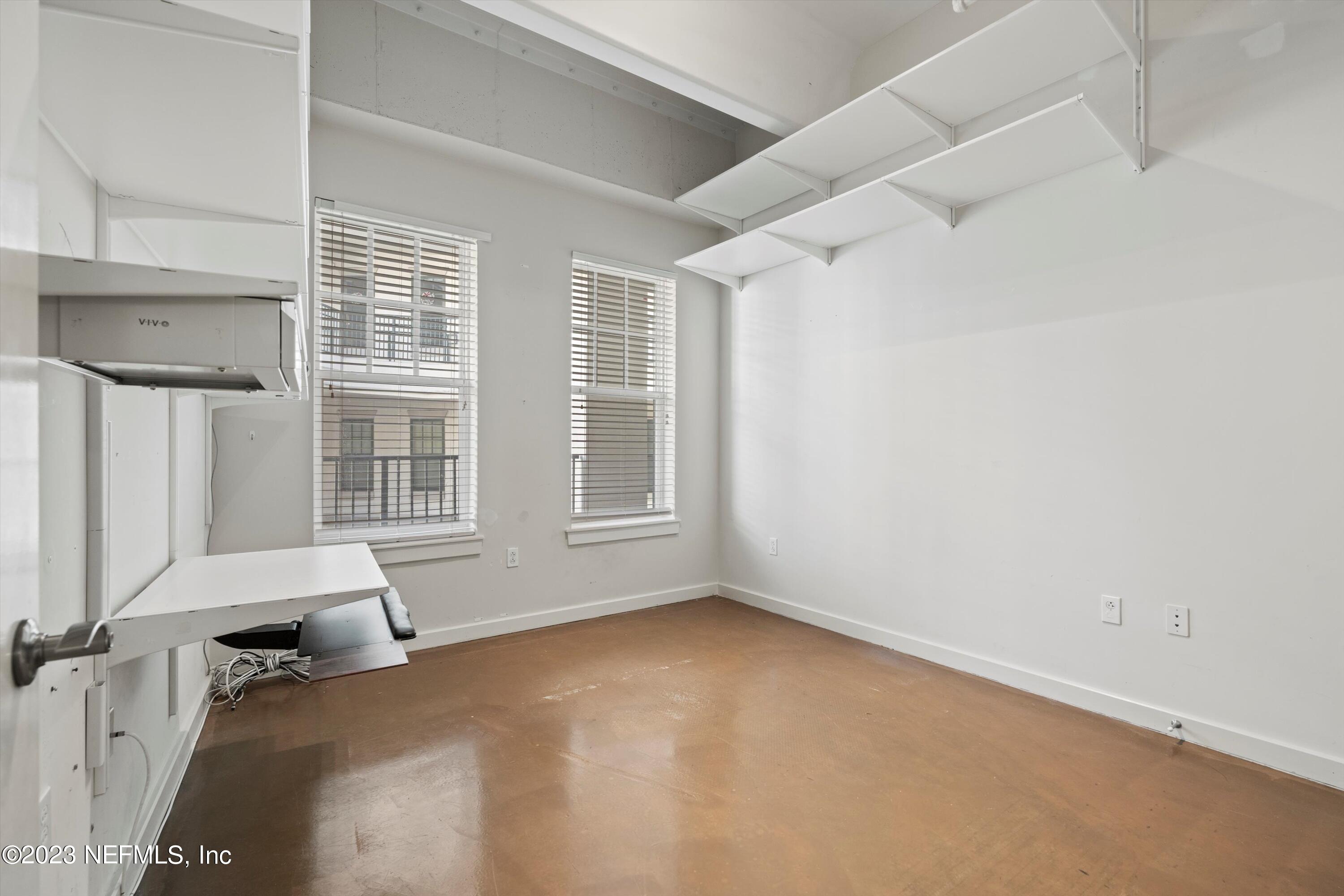1661 Riverside Avenue, Unit 211 Jacksonville, FL 32204 - Photo 10 of 32 an empty room with windows