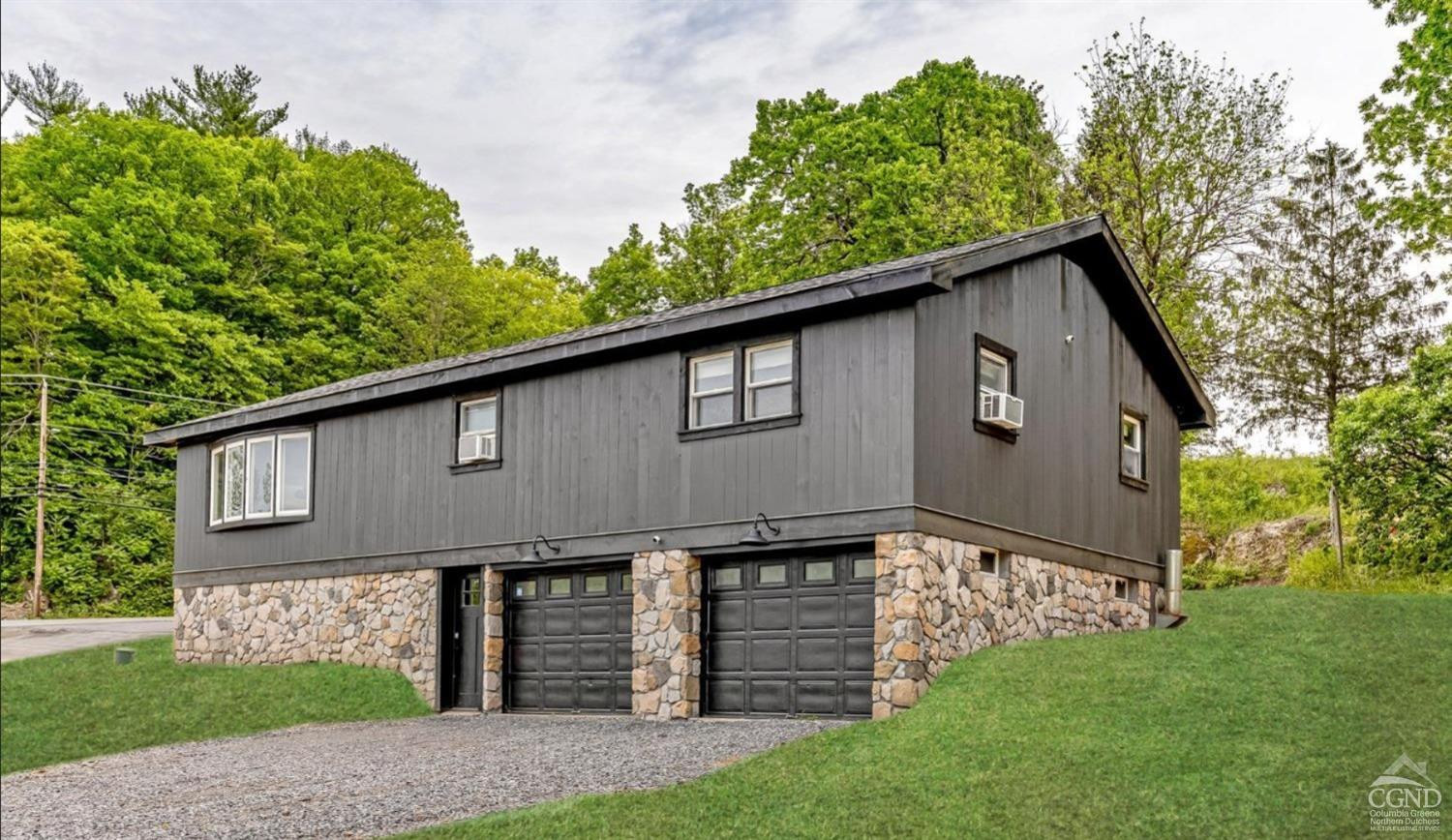 875 Road 23B Leeds, NY 12451 - Photo 17 of 38 a front view of a house with a garden and plants