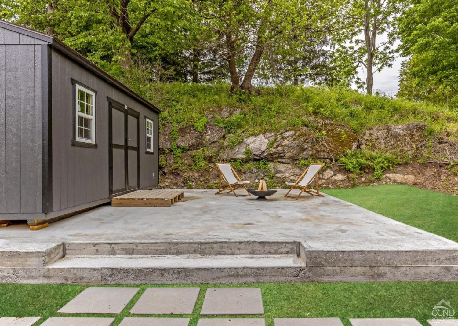 875 Road 23B Leeds, NY 12451 - Photo 28 of 38 a backyard of a house with large trees and parked