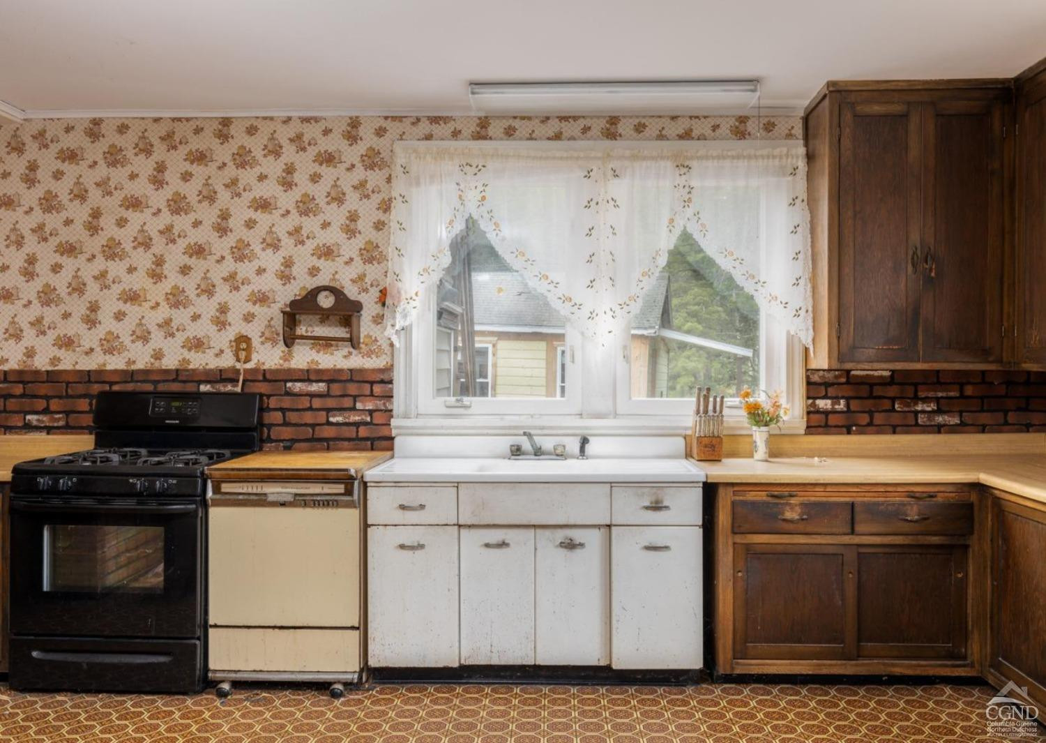 875 Road 23B Leeds, NY 12451 - Photo 36 of 38 a kitchen with a sink stove and cabinets